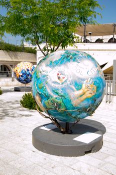 A globe statue  and some of the surroundings of Jerusalem