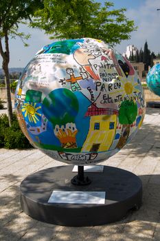 A globe statue  and some of the surroundings of Jerusalem