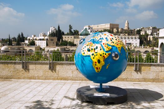 A globe statue  and some of the surroundings of Jerusalem