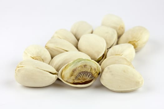 Pistachio nuts isolated on white background