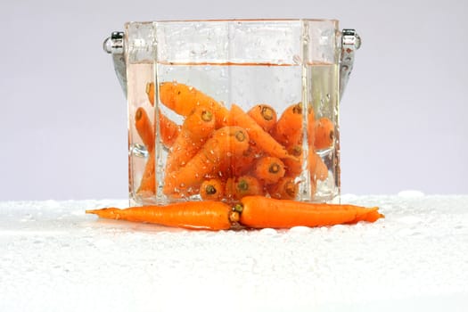 fresh carrots in water