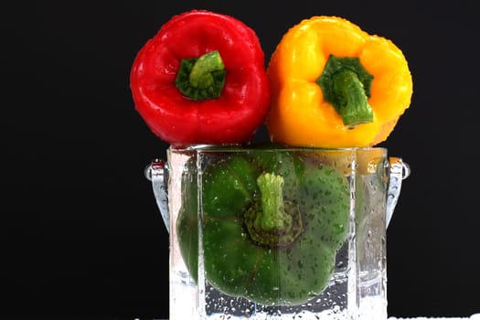 three fresh sweet pepper isolated and black blackgroung