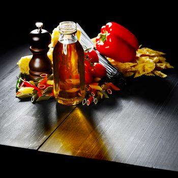 Pasta ingredients on black table, italian cuisine concept