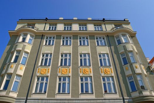 Building facade with traditional shutter windows, Tallinn, Estonia