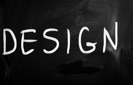 The word "Design" handwritten with white chalk on a blackboard
