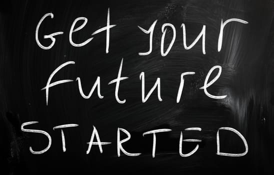 "Get your future started" handwritten with white chalk on a blackboard