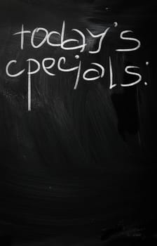 "Today's specials" handwritten with white chalk on a blackboard