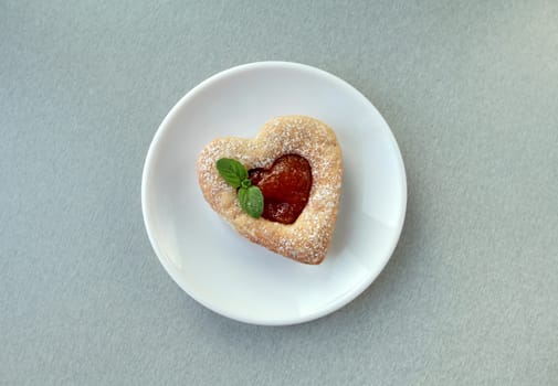 heart cookies on a plate close to