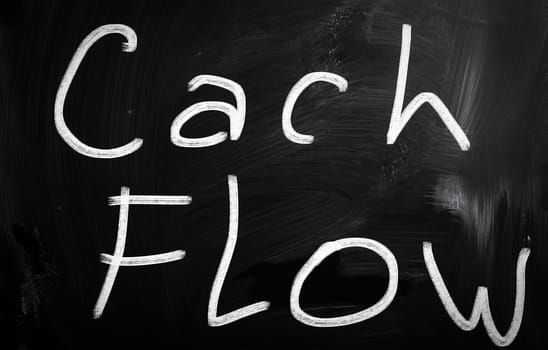 "Cash flow" handwritten with white chalk on a blackboard