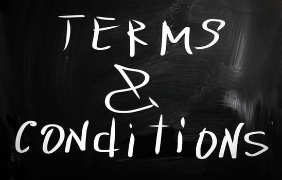 "Terms & Conditions" handwritten with white chalk on a blackboard