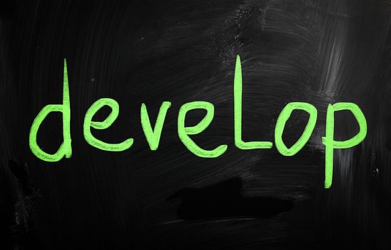 "Develop" handwritten with white chalk on a blackboard