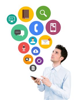 Handsome young man holding smartphone and looking on collection of colorful mobile application icons on communication and mobile connection theme. Isolated on white background.
