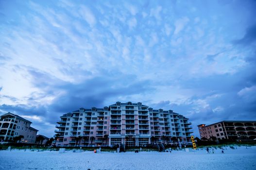 sunset on florida beach with white sand and blue sky