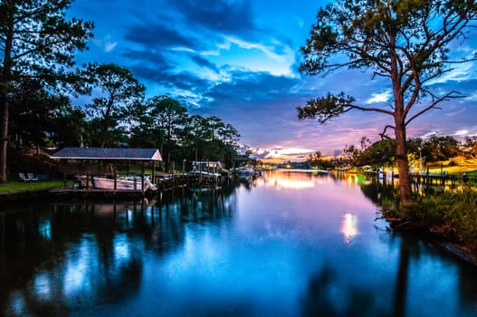 A Very Colorful Mythical Sunset Over water way near ocean