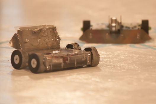 mini robot wars indoors by a human controllers