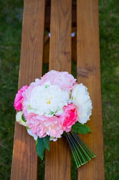 Flowers at a wedding ceremony celebration outdoors at a park.