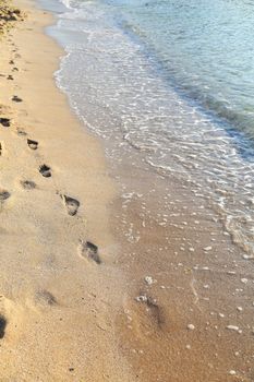 beach, wave and footsteps, yellow sand, blue sea