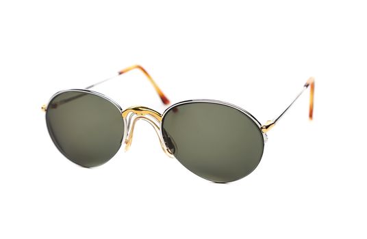 Sunglasses of yellow and white gold on a white background.