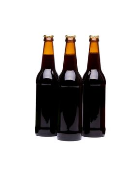 Three beer bottles. Isolated on white background