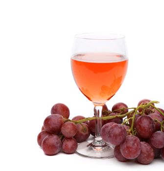 glass of wine and grapes isolated on the white background