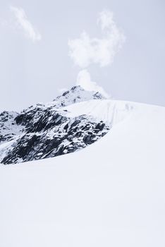 Snowed mountain summit and rocks in Himalaya. Travel to Nepal