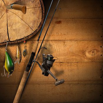 Wooden background with fishing tackle and knife