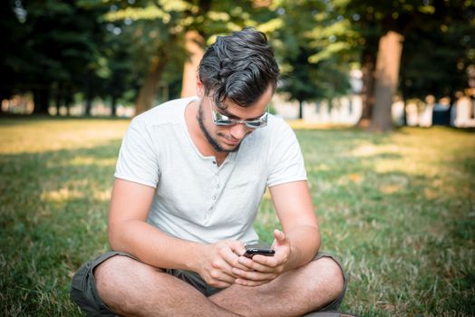 stylish man on the phone at the park