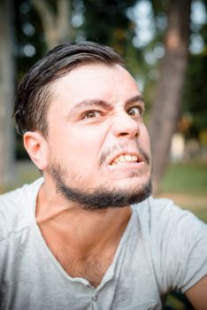 close up portrait of youg stylish man angry