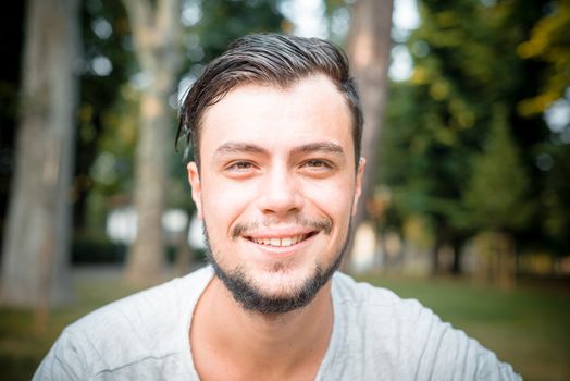 close up portrait of youg stylish man smiling