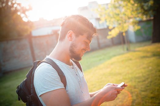 stylish man on the phone at the park