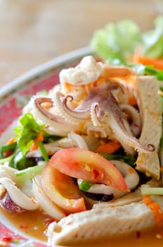  spicy mix salad with shrimp , squid , sausage and  fresh vegetable