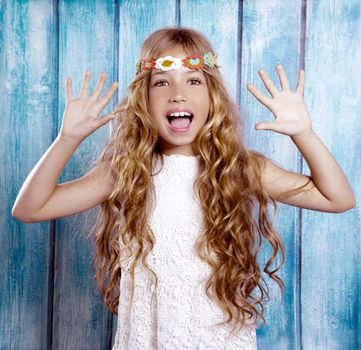 Hippie children girl excited open mouth with open hands and raised arms