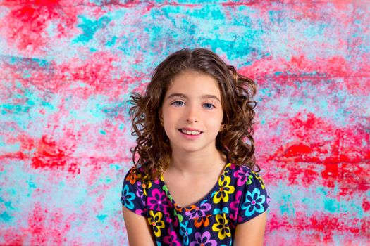 Bunette kid girl portrait smiling in grunge red green background
