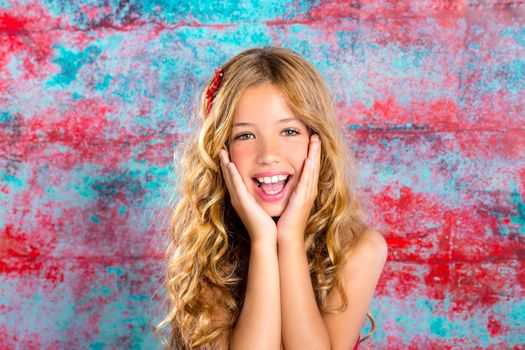 Blond kid girl happy smiling expression hands in face gesture