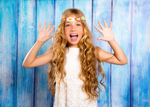 Hippie children girl excited open mouth with open hands and raised arms