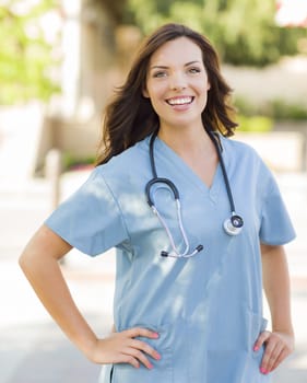 Attractive Young Adult Woman Doctor or Nurse Portrait Outside.