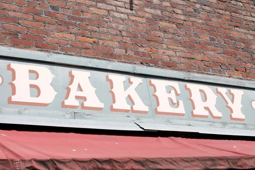 Sign on the exterior of a bakery.