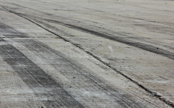 Background with tire marks on road track