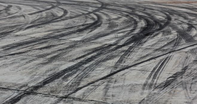 Background with tire marks on road track