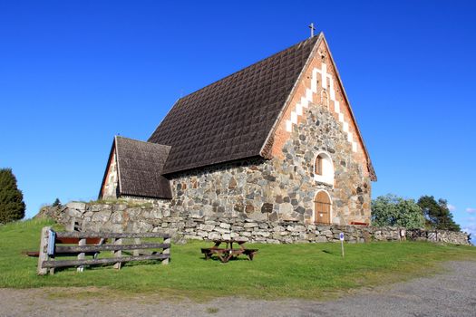The St. Olafs Church in Tyrvaa, Finland is a late medieval stone church in a natural setting. It was built probably in 1510-1516.