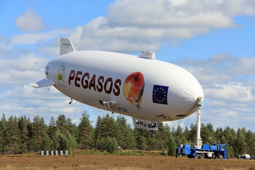 JAMIJARVI, FINLAND - JUNE 15, 2013: Pegasos Zeppelin NT airship attached to mast in Jamijarvi, Finland on June 15, 2013. The airship leaves Finland after ca. 30 research flights as part of the European PEGASOS project.