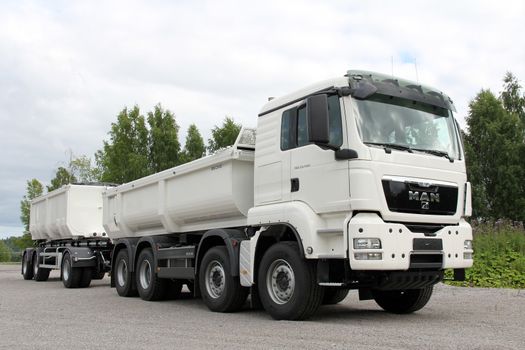 KARJAA, FINLAND - JULY 7, 2013: MAN TGS 35.480 Heavy duty truck parked in Karjaa, Finland on July 7, 13. MAN heavy duty trucks use SCR technology to satisfy the Euro 5 standard as well as the more stringent, optional EEV exhaust emissions standard.