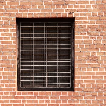 Window and red brick wall