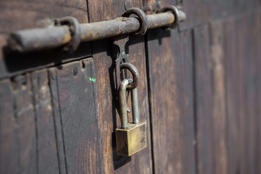 Padlock, close up wood door with metal locked