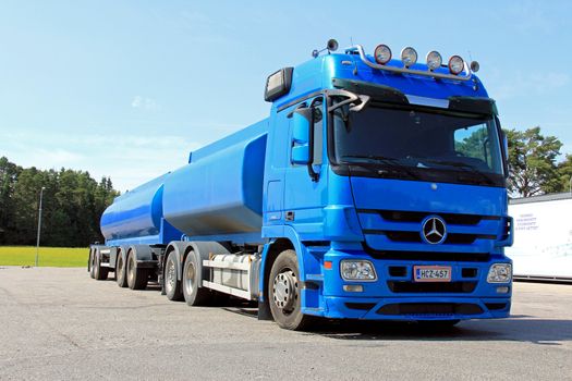 SALO, FINLAND - JULY 14, 2013: Mercedes Benz truck and full trailer parked in Salo, Finland. To meet the stringent Euro VI emission standards, Mercedes Benz combines SCR, EGR and DPF technologies.