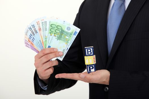 successful businessman holding money