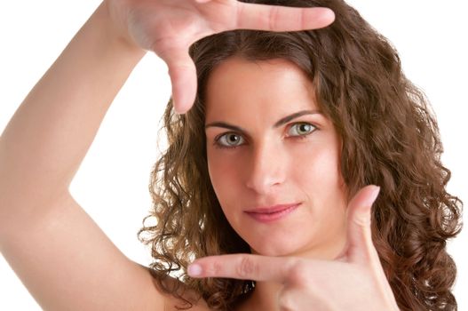 Woman framing a picture with her hands, isolated in white