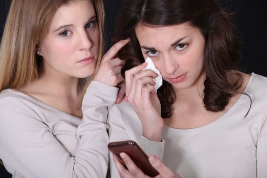 Woman comforting friend