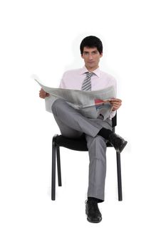 Businessman reading a newspaper