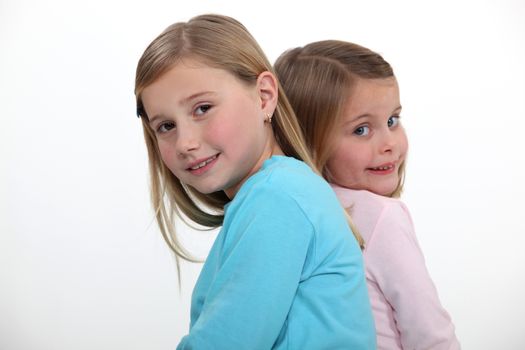 two little girls posing together